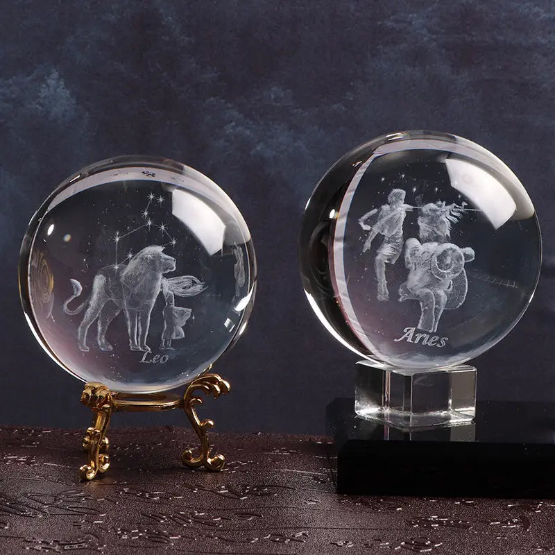 Zodiac signs crystal balls with Leo on gold stand and Aries on black base