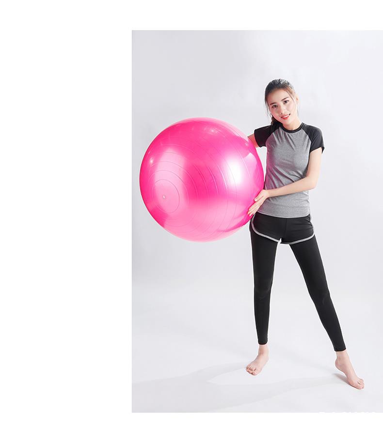 Vibrant pink Fitness Yoga Ball with glossy surface and grip patterns