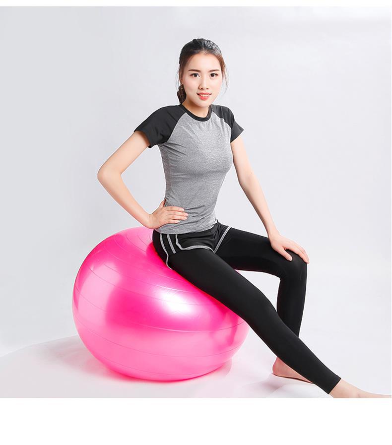 Vibrant pink Fitness Yoga Ball with smooth glossy surface