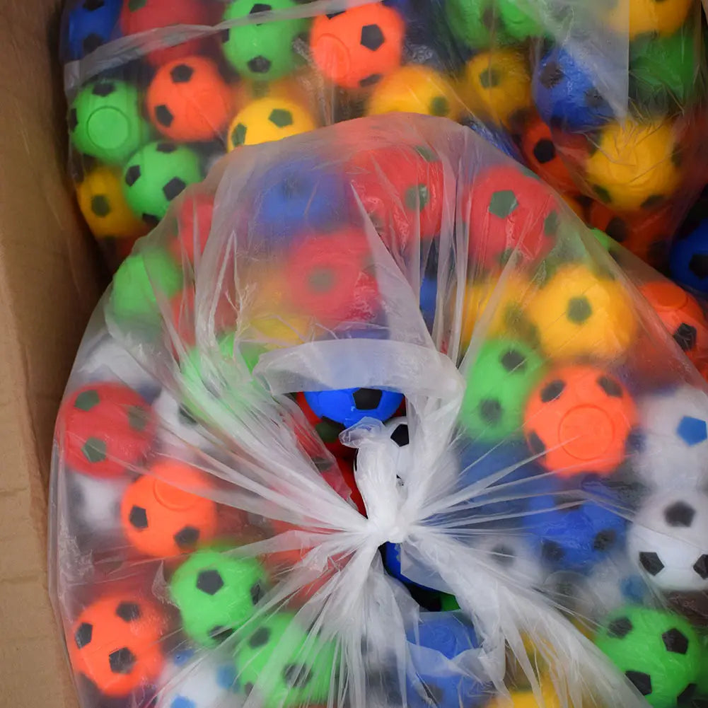 Colorful SOCCER FIDGET BALLS with red, green, blue, yellow hues and black pentagons.