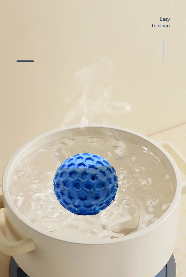 Blue hexagonal Indestructible Squeaky Dog Ball floating in steaming water