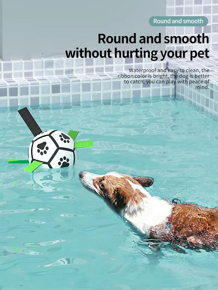 Interactive white black soccer ball dog toy with green ribbons