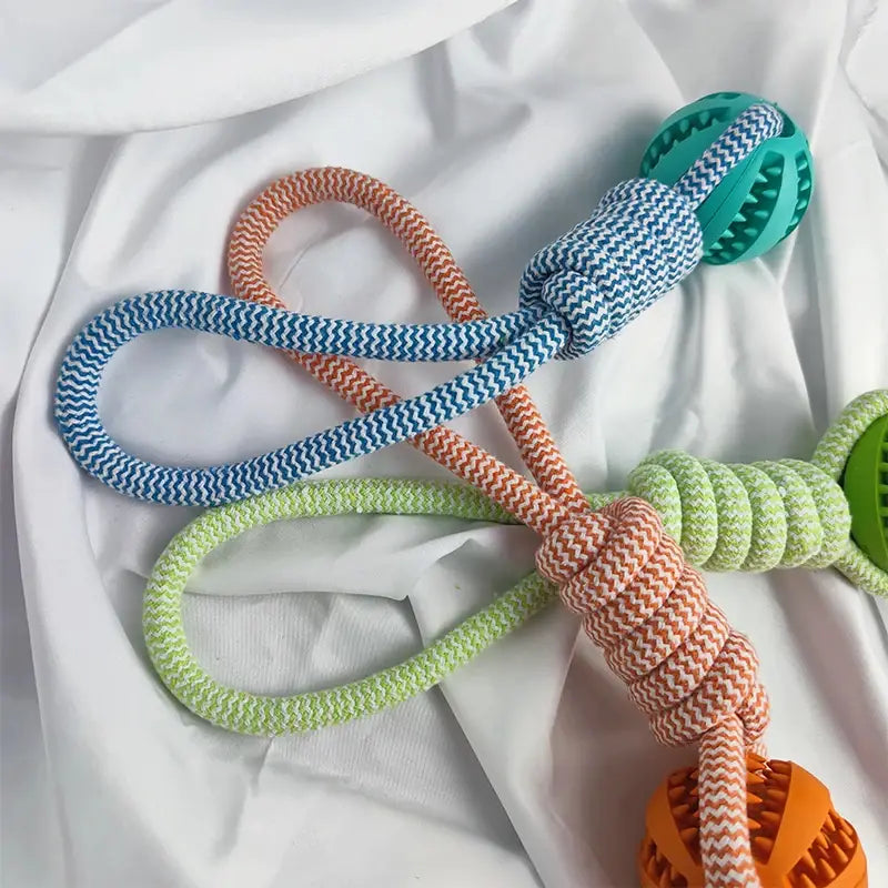Colorful braided rope dog toy with textured rubber balls, Interactive Dog Treat Rope Ball