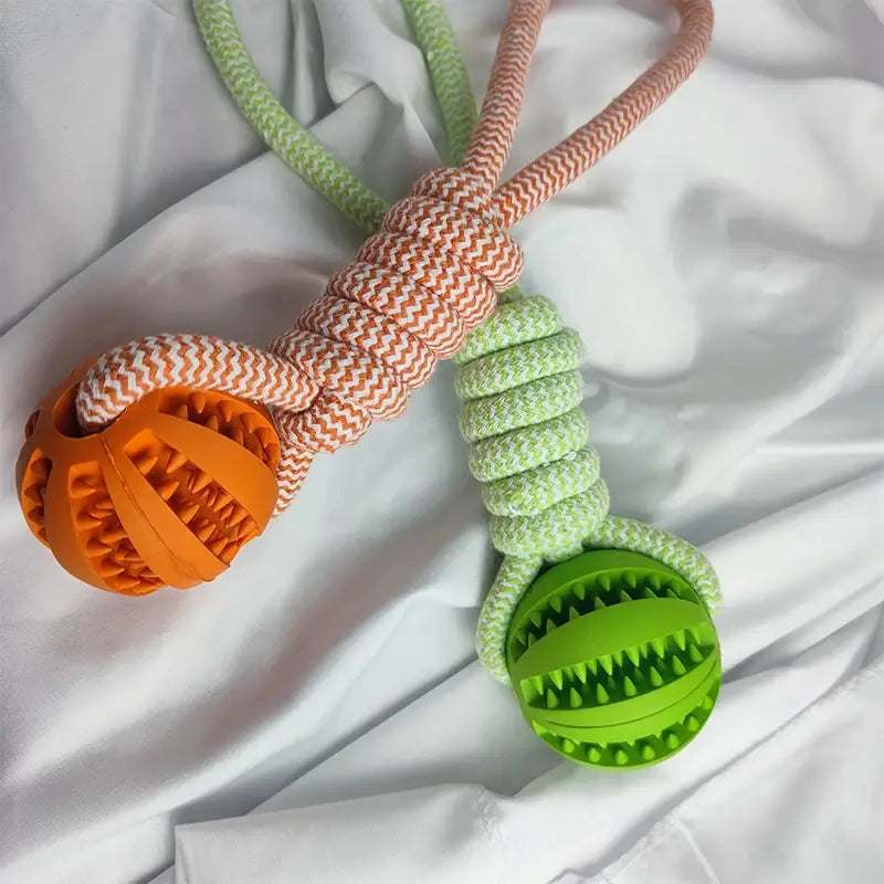 Orange and green silicone Interactive Dog Treat Rope Ball chew toys with braided rope handles