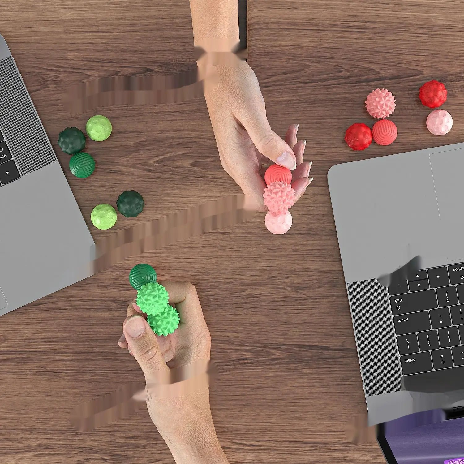Hands holding colorful green and pink Silicone Magnetic Sensory Balls.