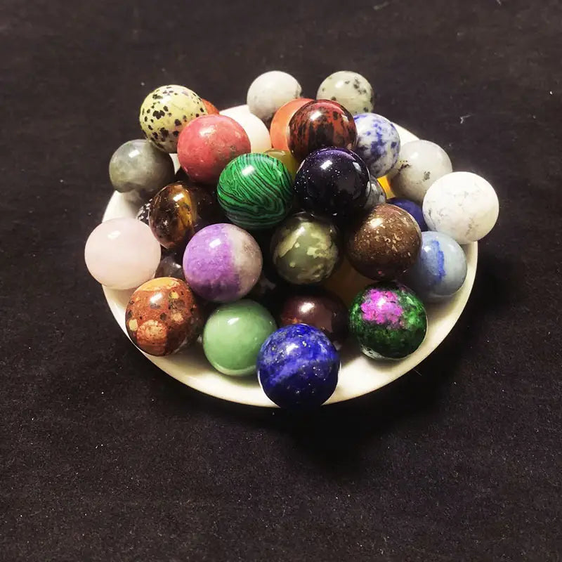 Polished multicolored natural crystal ball ornaments in gemstone hues