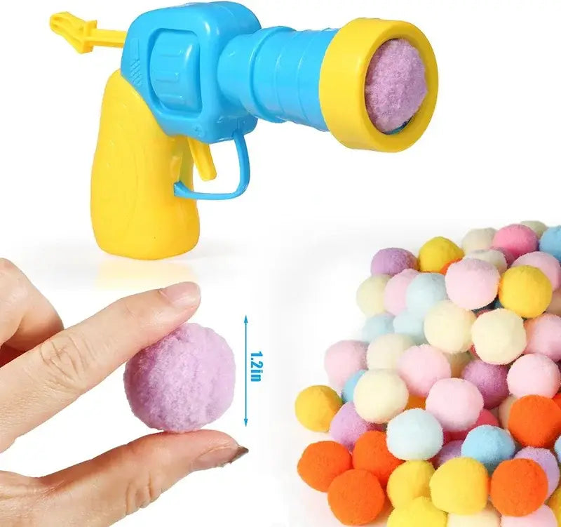 Interactive cat toy launcher with brightly colored water gun and purple pellets