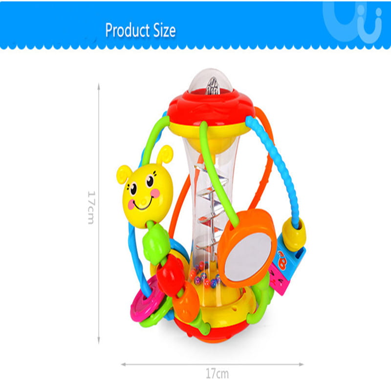 Baby hand holding rattle ball