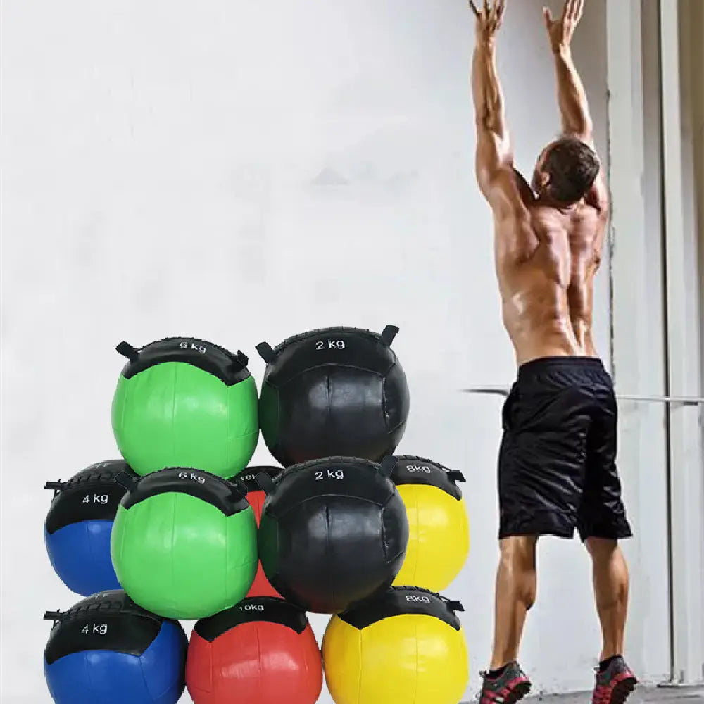 Stack of colorful weighted Training Fitness Balance Gravity Balls in black, green, blue, red, yellow with labels