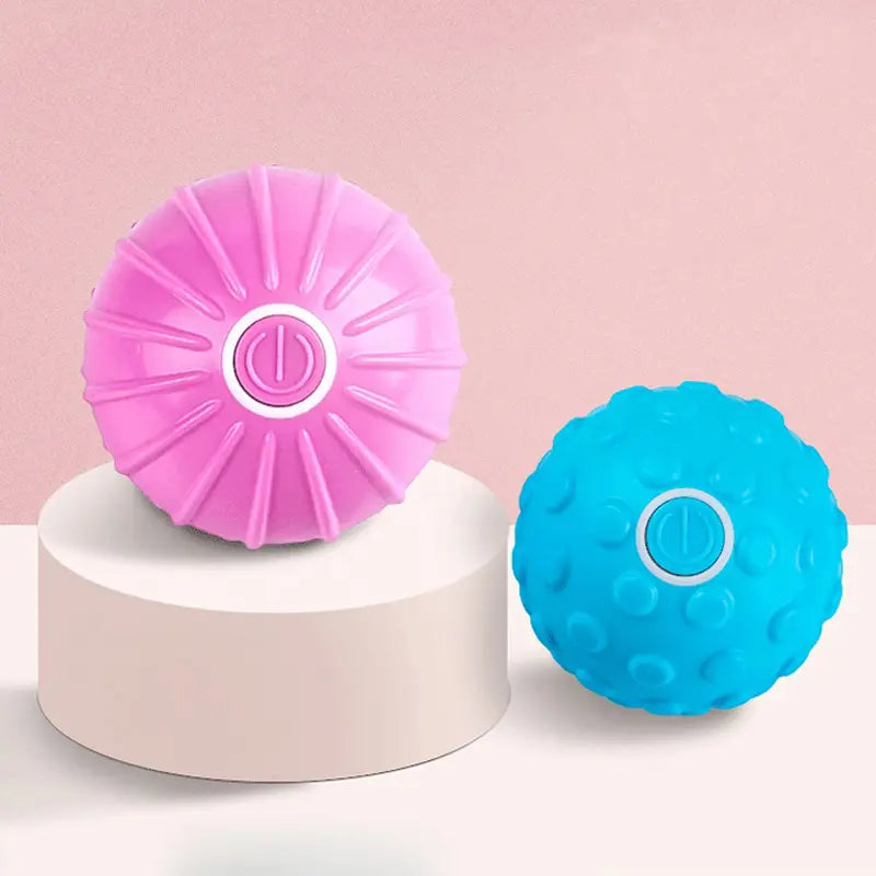 Pink and blue Electric muscle relaxation balls with textured surfaces and power buttons