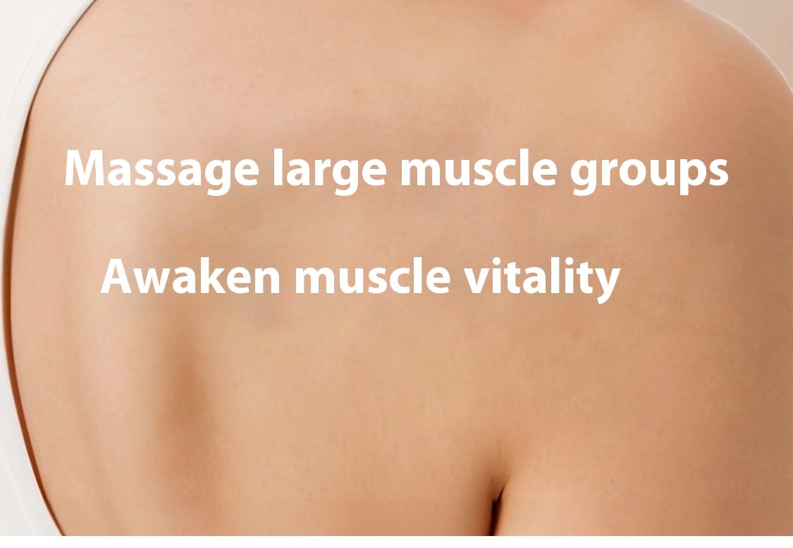 Close-up of upper back and shoulder on electric deep massage yoga ball