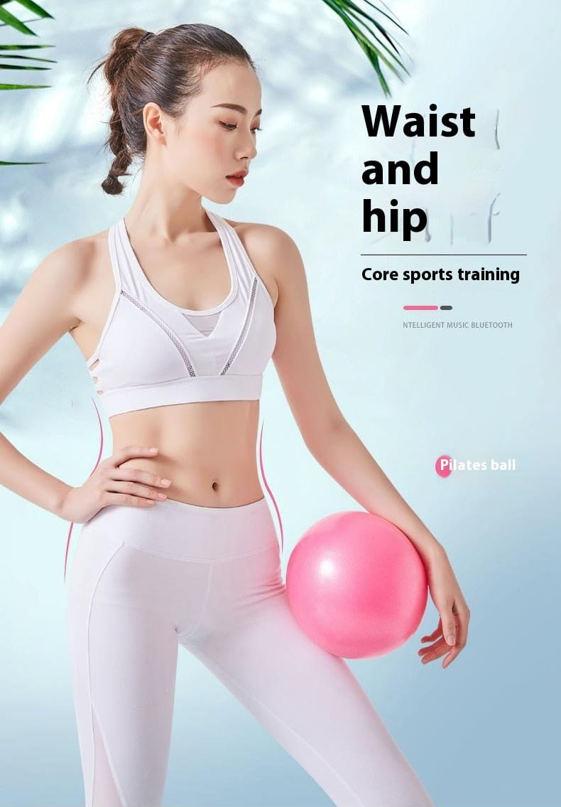 Hand holding pink Pilates ball for pelvic floor muscle training
