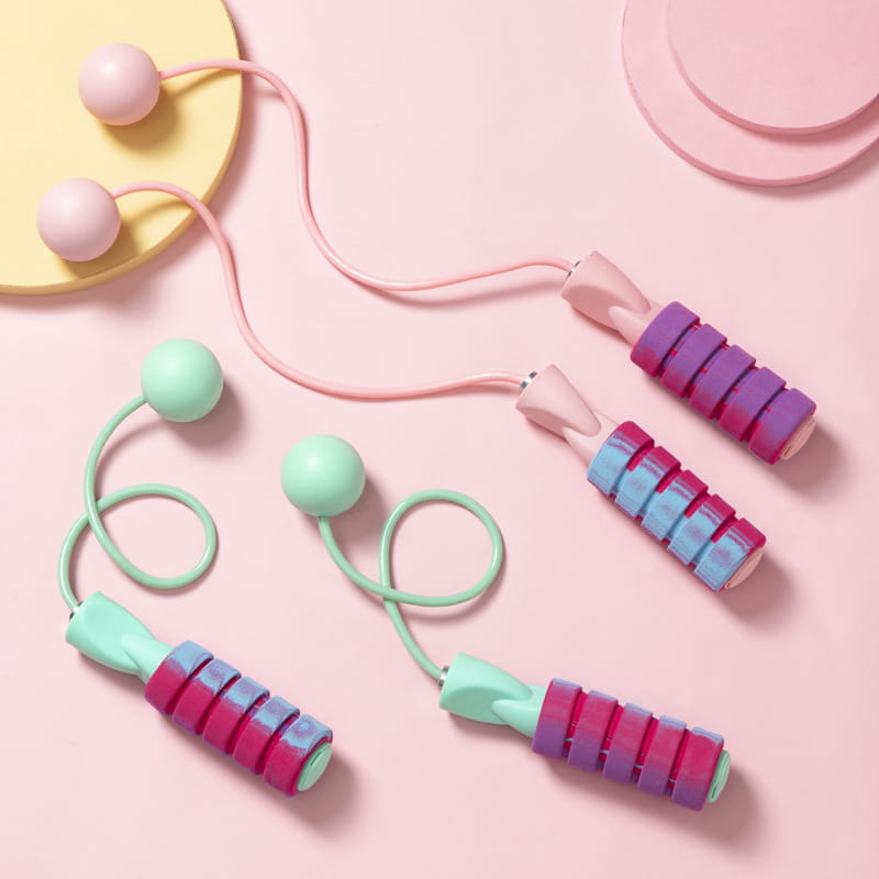 Weighed skipping rope with pastel colors, soft rounded handles, colorful grips