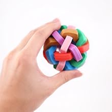 Hand holding colorful braided Light Up Bell Dog Ball toy